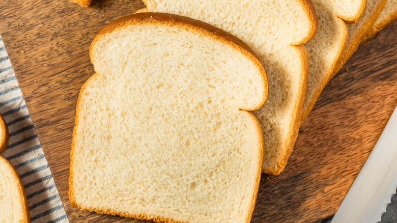 Sandwich bread slices on cutting board