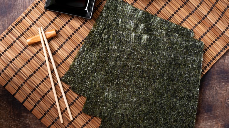 Sheets of nori with chopsticks