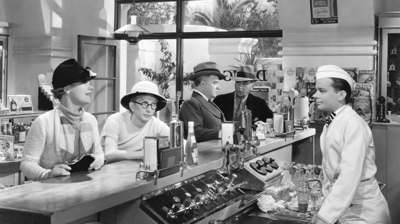 people at old-time soda fountain