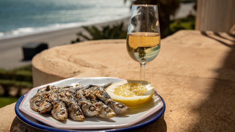 Grilled sardines and wine beach