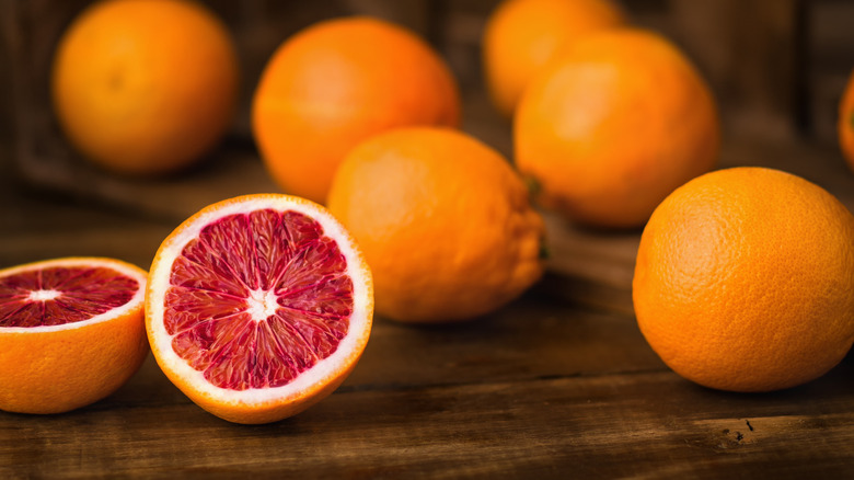 blood oranges on wooden board