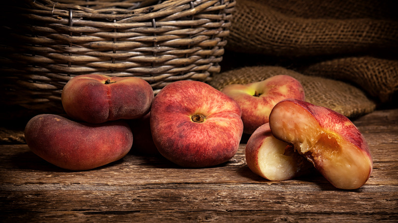 snuffbox peaches on wooden table