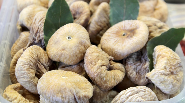 many dried figs in container