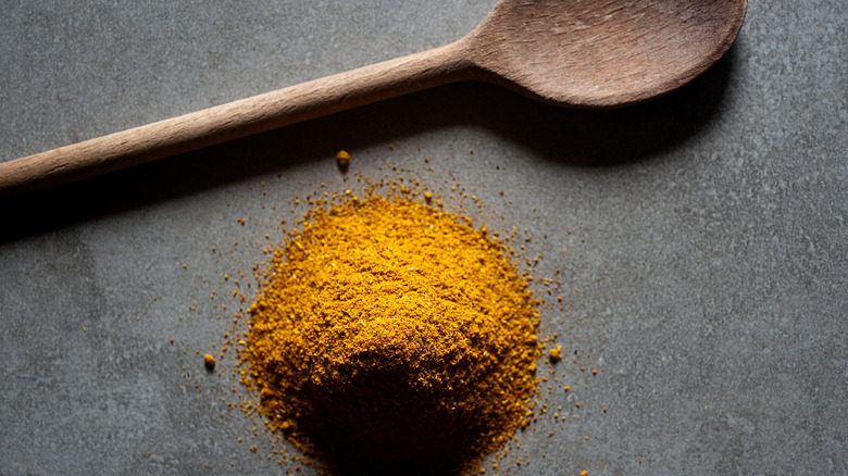 Curry powder with spoon