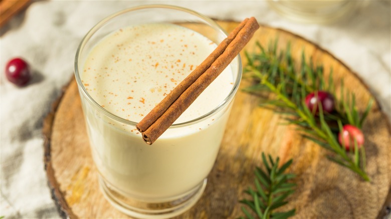 Egg nog with cinnamon sticks