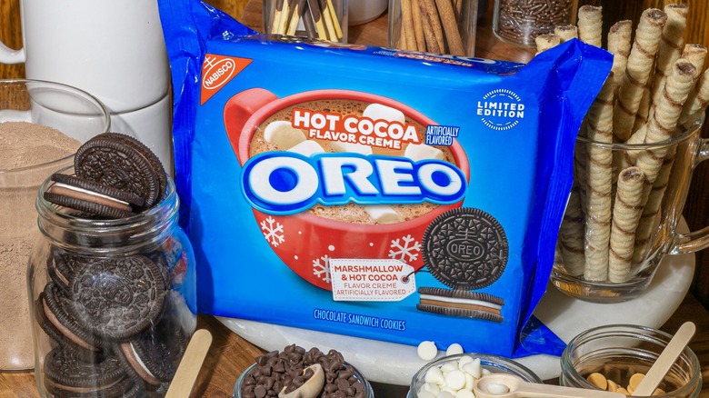 Package of Oreos surrounded by toppings