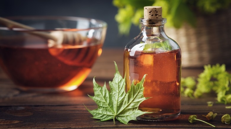 Bottle of maple syrup with maple leaf