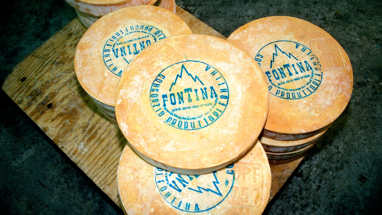 wheels of Fontina cheese