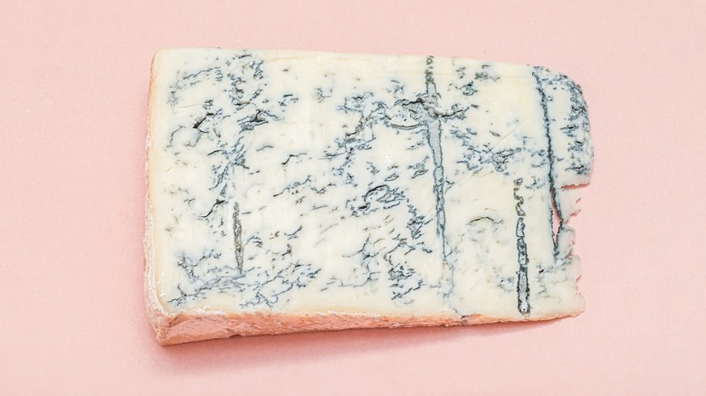 Gorgonzola on pink background