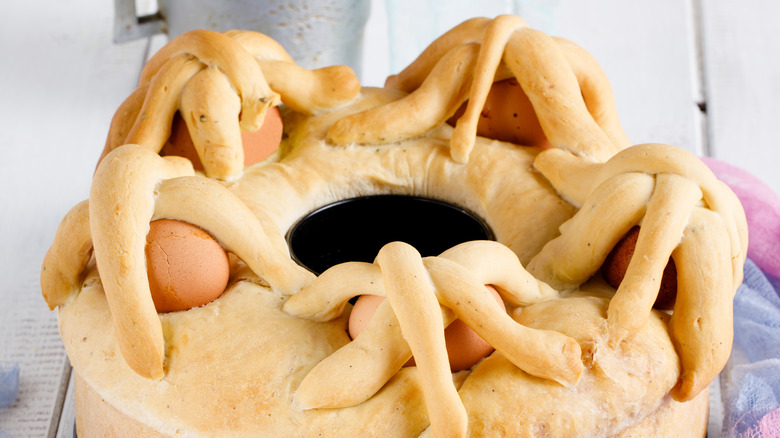 Close up of a casatiello with whole eggs