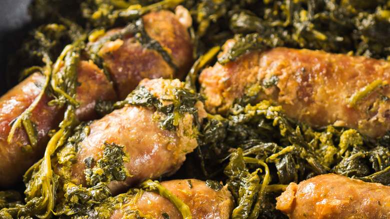 Sausage with rapini broccoli cooked in a skillet