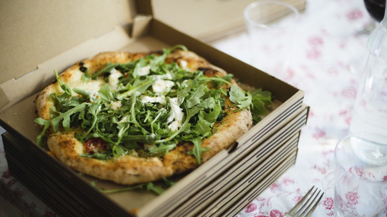 Pizza with fresh arugula