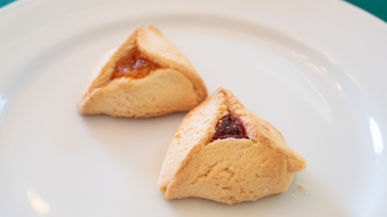 two triangular jam filled hamentashen