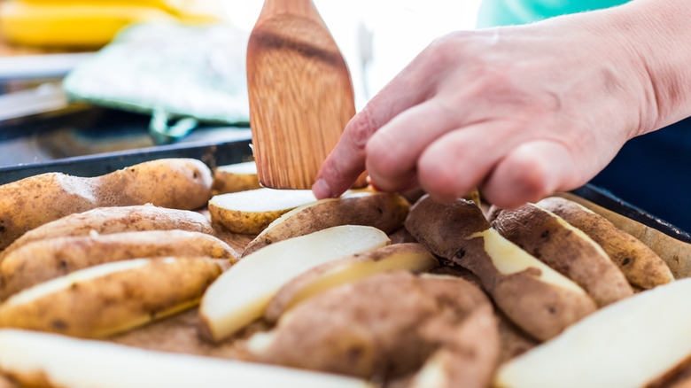 Turning potatoes halfway through cooking