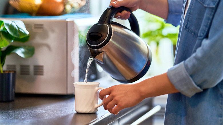 pouring hot water into mug