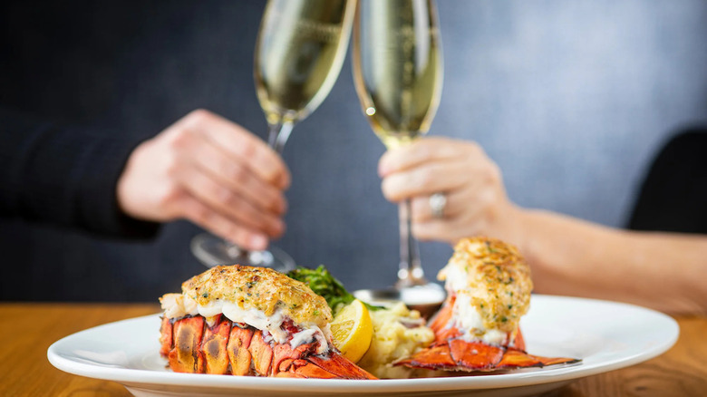 Plate of lobster tails and champagne glasses