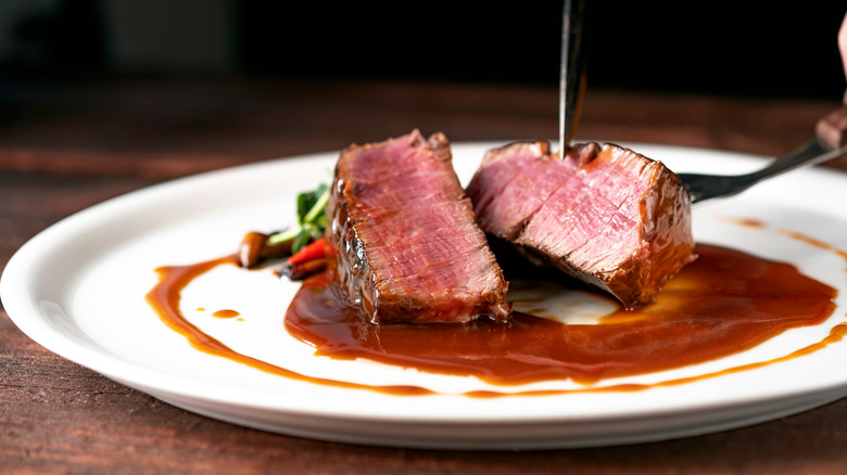 Steak in demi-glace on plate