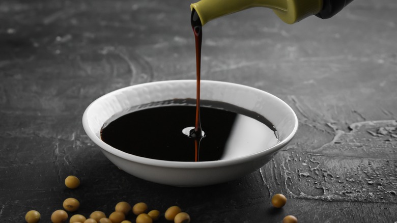 Soy sauce in white bowl