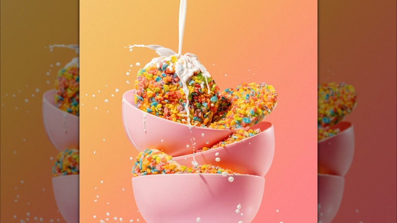 Crumbl cookie Milk Glaze with Fruity PEBBLES in a bowl