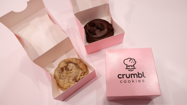 Crumbl cookies in pink boxes
