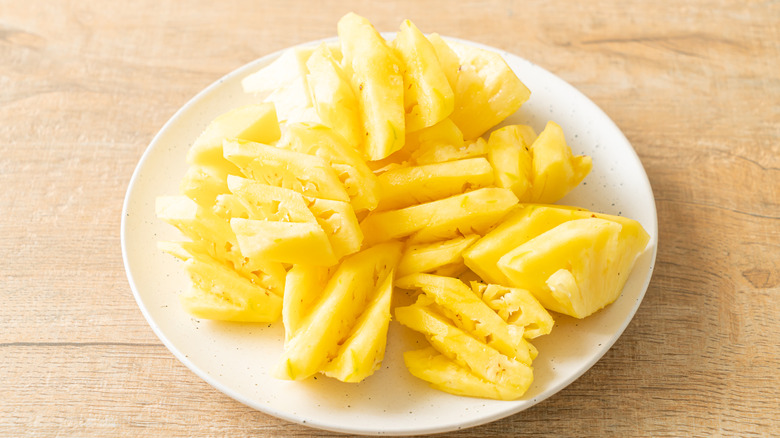 Plate with fresh sliced pineapple