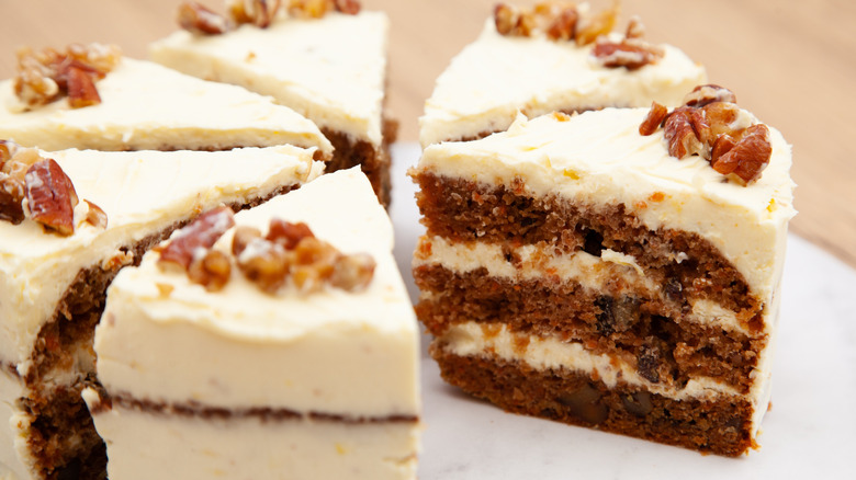 Sliced carrot cake with nuts and raisins