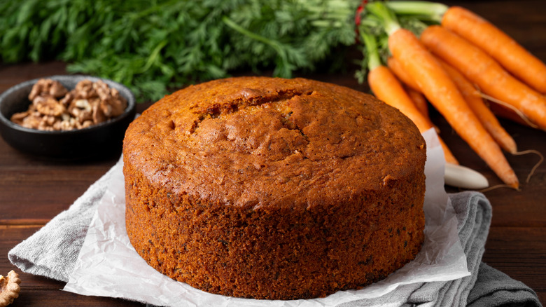 Carrot cake with nuts and carrots on the side