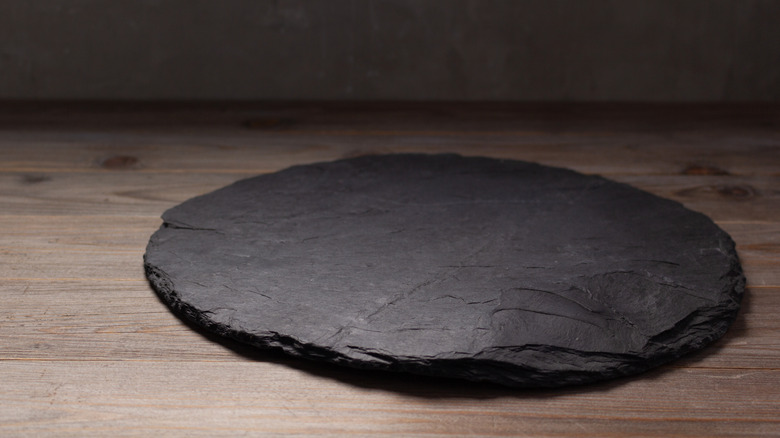 Pizza slate on wooden table