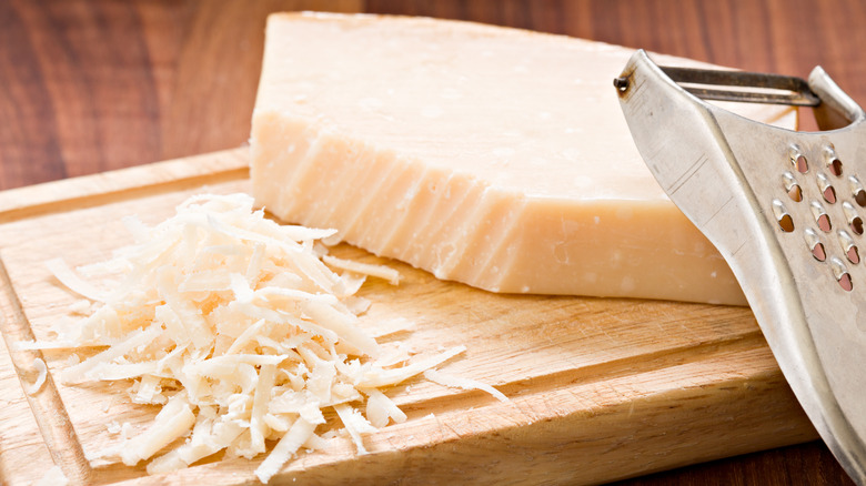 Grated parmesan with wooden board