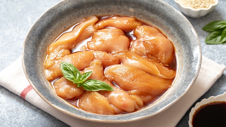 Chicken marinating in bowl 