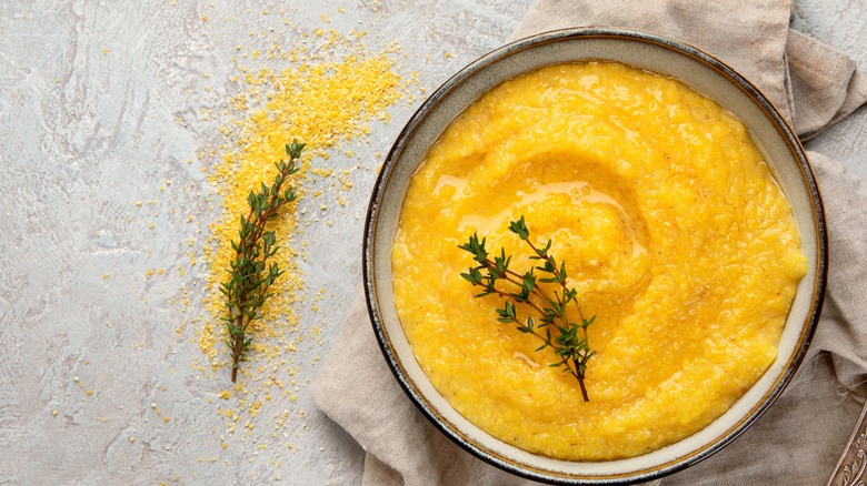 Cooked polenta with thyme sprigs