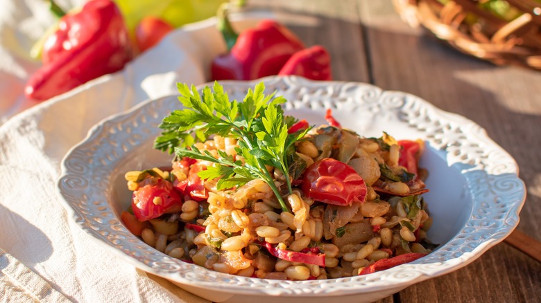 cooked kamut, tomatoes, and herbs