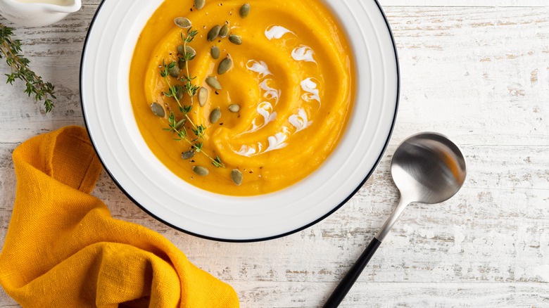 pumpkin soup and spoon 