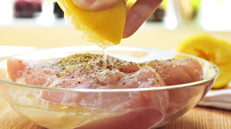 Marinating chicken in a bowl