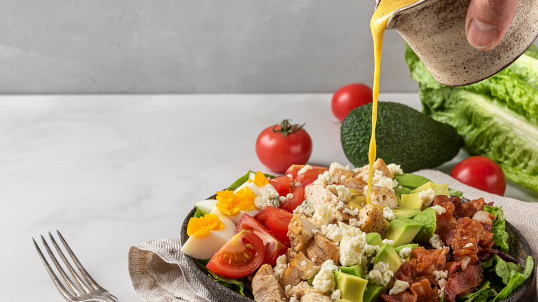 Dressing poured on a salad