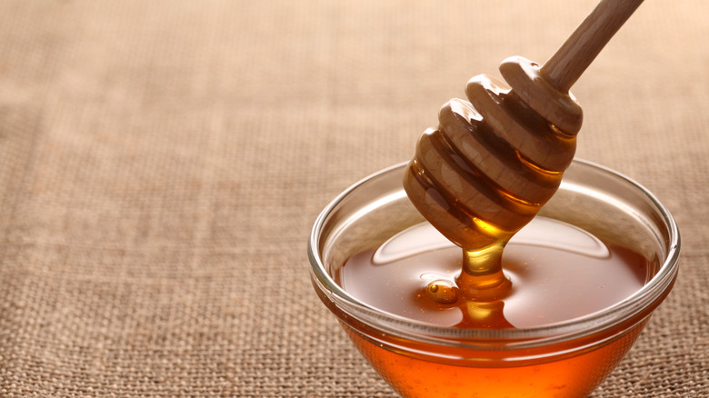 Honey in jar with scoop