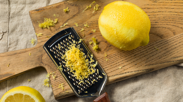 lemon zest on wooden board