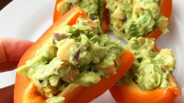 orange pepper stuffed with guacamole