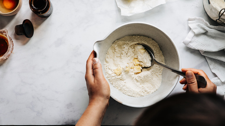 Person making homemade pie crust 