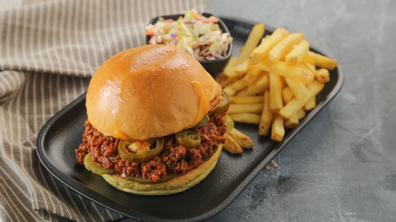 Sloppy Joe with coleslaw and fries on plate