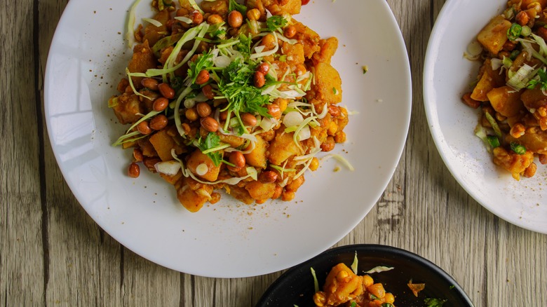 Indian dishes topped with cabbage