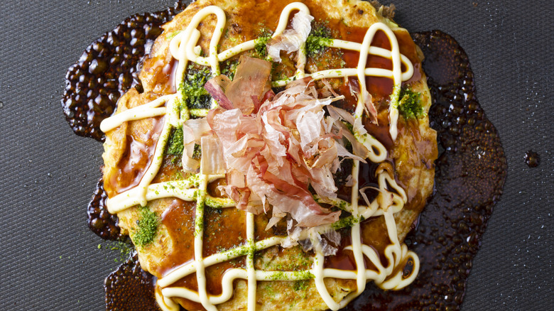 Okonomiyaki with various toppings