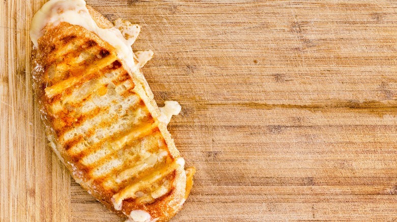 Panini sandwich on wooden board