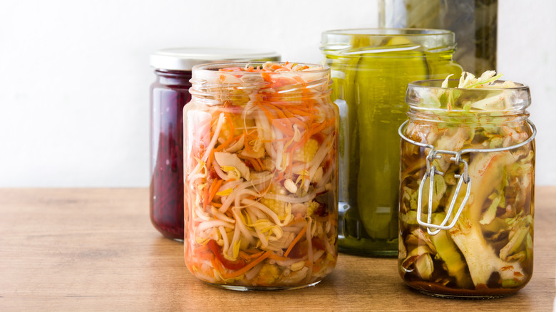 various pickled vegetables in jars