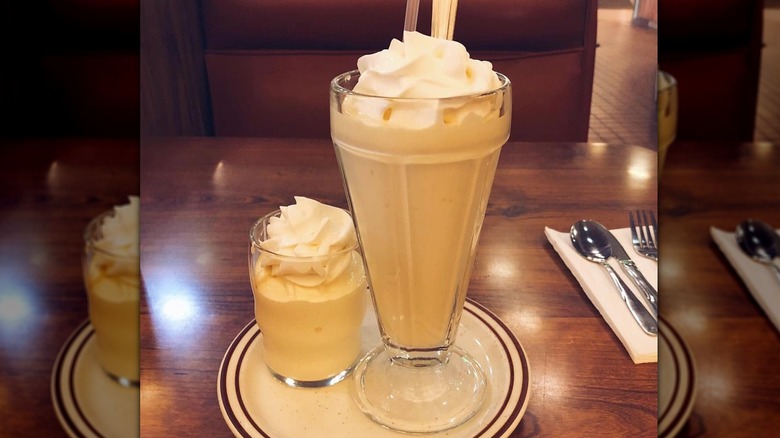 Banana milkshake on wooden table