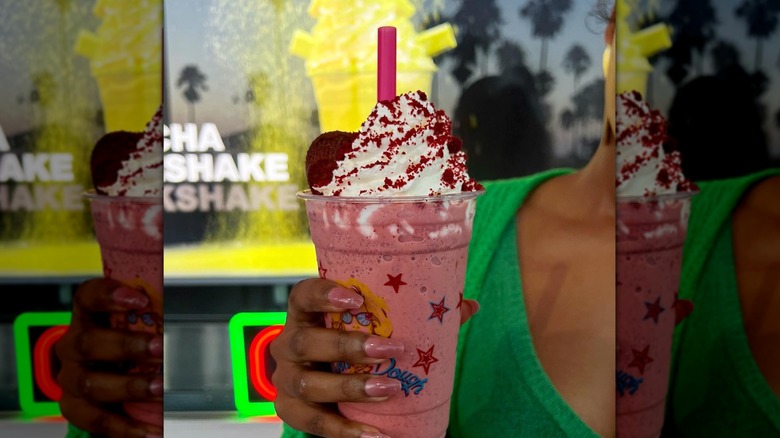 Woman holding Red Velvet milkshake