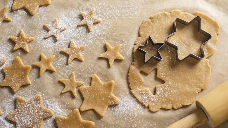 Star cut-outs of dough with cookie cutters