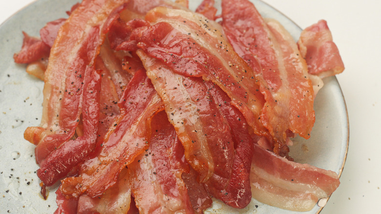 bacon slices stacked on plate