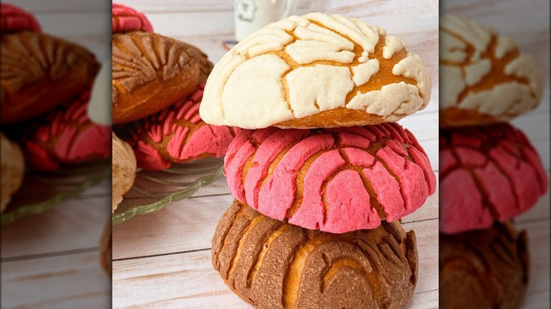 Conchas pastries stacked on table