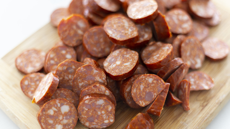 Sliced chorizo on a cutting board